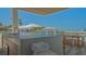 Outdoor kitchen by the pool with dining area and views of the Longboat Key beach at 4651 Gulf Of Mexico Dr # 304, Longboat Key, FL 34228