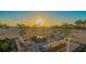 Inviting beachside patio featuring comfortable seating and a modern fire pit, perfect for enjoying sunset views at 4651 Gulf Of Mexico Dr # 304, Longboat Key, FL 34228