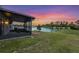 View from the lanai reveals a serene backyard with a calming lake backdrop at 4767 Reisswood Loop, Palmetto, FL 34221