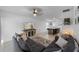 Living room view towards the open kitchen features comfortable seating and a large screen TV at 4767 Reisswood Loop, Palmetto, FL 34221