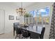 Dining room features a dark wood table and chairs with a decorative chandelier at 5449 Downham Mdws, Sarasota, FL 34235