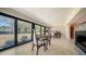 Dining room features large windows offering backyard views at 5458 Golf Pointe Dr, Sarasota, FL 34243
