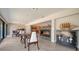 Bright dining room offers modern fireplace and elegant furnishings at 5458 Golf Pointe Dr, Sarasota, FL 34243