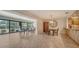 Elegant dining area featuring large glass windows with views of the outside at 5458 Golf Pointe Dr, Sarasota, FL 34243