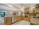 Open kitchen boasts granite countertops, stainless appliances, and tile flooring at 5458 Golf Pointe Dr, Sarasota, FL 34243