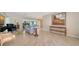 Spacious living room with fireplace, tile floors and modern furnishings at 5458 Golf Pointe Dr, Sarasota, FL 34243