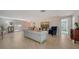 Bright and inviting living room with tile flooring, leading to a private courtyard at 5458 Golf Pointe Dr, Sarasota, FL 34243