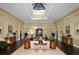 Bright lobby featuring a high skylight, neutral walls, dark wood floors, and comfortable seating for a relaxing atmosphere at 5458 Golf Pointe Dr, Sarasota, FL 34243