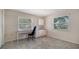 Office with built in desk and cabinets, tile floor and large window at 5458 Golf Pointe Dr, Sarasota, FL 34243