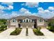 Aerial view of townhomes with attached garages, manicured lawns, and beautiful landscaping at 5543 Pleasantview Ct, Bradenton, FL 34211