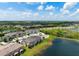 Aerial view of the community showcasing the pond, lush landscaping, and well-maintained homes at 5543 Pleasantview Ct, Bradenton, FL 34211