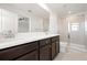 Bathroom showcasing a vanity with solid countertop, a toilet, and a glass-enclosed shower with tiled walls at 5543 Pleasantview Ct, Bradenton, FL 34211