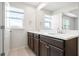 Bright bathroom featuring a double vanity with modern fixtures and ample natural light from the window at 5543 Pleasantview Ct, Bradenton, FL 34211