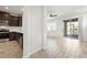View of modern kitchen and adjacent living area with sliding doors to a screened lanai at 5543 Pleasantview Ct, Bradenton, FL 34211