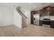 Open concept kitchen with stainless steel appliances and carpeted stairs at 5543 Pleasantview Ct, Bradenton, FL 34211