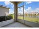 Screened lanai offers serene views of the pond and surrounding neighborhood at 5543 Pleasantview Ct, Bradenton, FL 34211
