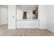 Open-concept living area showcases wood-look tile flooring and views into the kitchen at 5543 Pleasantview Ct, Bradenton, FL 34211