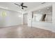 Open-concept living area showcases wood-look tile flooring and views into the stairway at 5543 Pleasantview Ct, Bradenton, FL 34211