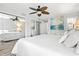 Bright bedroom featuring a ceiling fan, large closet, and a serene wall painting for a peaceful retreat at 5663 Midnight Pass Rd # 407, Sarasota, FL 34242