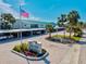 Welcome to White Sands Village featuring a manicured entrance and covered parking at 5663 Midnight Pass Rd # 407, Sarasota, FL 34242