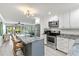 Bright open kitchen with stainless steel appliances, granite countertops and breakfast bar at 5663 Midnight Pass Rd # 407, Sarasota, FL 34242