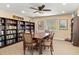 Well-stocked library with a large table, chairs, and plenty of natural light for reading at 5663 Midnight Pass Rd # 407, Sarasota, FL 34242