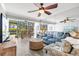 Comfortable living room with a large window offering views of the serene outdoor space at 5663 Midnight Pass Rd # 407, Sarasota, FL 34242