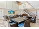 Spacious meeting room featuring a high ceiling, staircase, and comfortable seating arrangements at 5663 Midnight Pass Rd # 407, Sarasota, FL 34242