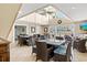 Open meeting room with comfortable seating, high ceilings, fan, and easy access to the pool at 5663 Midnight Pass Rd # 407, Sarasota, FL 34242