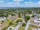 Aerial shot showcasing property with fenced yard, lush landscaping, and convenient neighborhood access at 5704 2Nd Avenue Nw Dr, Bradenton, FL 34209