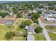 Aerial view of the property showing the home, lawn, landscaping, and the surrounding neighborhood at 5704 2Nd Avenue Nw Dr, Bradenton, FL 34209