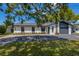 Charming single story home with a well manicured front yard and black windows at 5704 2Nd Avenue Nw Dr, Bradenton, FL 34209