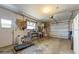 Functional garage with storage, workbench, and space for parking or hobbies at 5704 2Nd Avenue Nw Dr, Bradenton, FL 34209