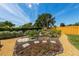 Beautiful garden featuring an array of plants and greenery, stone pavers, and wood fencing at 5704 2Nd Avenue Nw Dr, Bradenton, FL 34209
