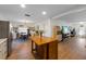 Modern kitchen that flows seamlessly into dining and living areas for entertaining at 5704 2Nd Avenue Nw Dr, Bradenton, FL 34209