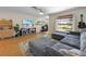 Comfortable living room with a large window, a gray sofa, and stylish decor at 5704 2Nd Avenue Nw Dr, Bradenton, FL 34209