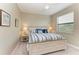 Bedroom featuring a ceiling fan, neutral walls, and large bed with bedside tables at 5810 Brandon Run, Bradenton, FL 34211
