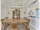 Cozy dining room featuring traditional wood furniture and a view of the living room area at 5810 Brandon Run, Bradenton, FL 34211