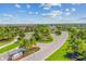 Grand entrance featuring lush landscaping, a water feature, and a welcoming archway into the community at 5810 Brandon Run, Bradenton, FL 34211
