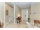 Bright entryway featuring tile floors, a decorative glass front door, and neutral color scheme at 5810 Brandon Run, Bradenton, FL 34211