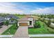 Stunning single-Gathering home featuring a tile roof, paver driveway, lush landscaping, and a two-car garage at 5810 Brandon Run, Bradenton, FL 34211