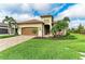 Charming single-Gathering home with a two-car garage, well-manicured lawn, and beautiful landscaping at 5810 Brandon Run, Bradenton, FL 34211