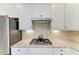 Updated kitchen features granite counters, stainless appliances, stylish backsplash, and white cabinets at 5810 Brandon Run, Bradenton, FL 34211