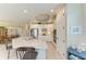 Bright kitchen featuring a large granite island, stainless steel appliances, and an open layout to dining areas at 5810 Brandon Run, Bradenton, FL 34211