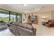 Comfortable living room with large sliding glass doors offering views of the lanai and outdoor area at 5810 Brandon Run, Bradenton, FL 34211