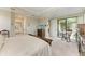 Relaxing main bedroom offers golf course views and outdoor access to the patio at 5810 Brandon Run, Bradenton, FL 34211