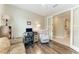 Hardwood floor office space with desk, accent chair, and ample lighting at 5810 Brandon Run, Bradenton, FL 34211