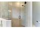 Tiled shower has glass enclosure and sleek fixtures at 5810 Brandon Run, Bradenton, FL 34211