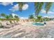 Relaxing spa pool surrounded by lounge chairs and lush landscaping for ultimate comfort at 5810 Brandon Run, Bradenton, FL 34211