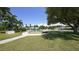 Beautiful community park featuring mature trees, benches, and a central water fountain at 5912 Driftwood Ave # 22, Sarasota, FL 34231